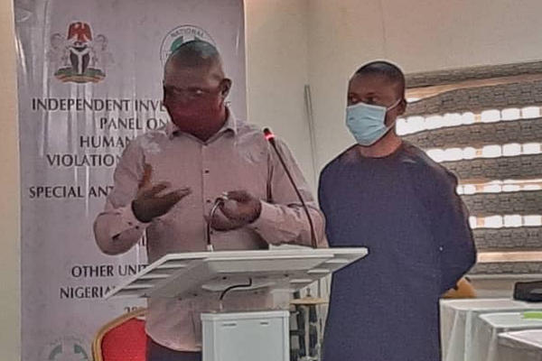 A witness testifying before the Independent Investigative Panel on human rights violations by the disbanded Special Anti-Robbery Squad (SARS)