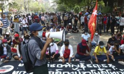 Protesters occupy a street during a rally against the military coup Saturday, March 27, 2021, in Tarmwe township in Yangon, Myanmar. The head of Myanmar's junta on Saturday used the occasion of the country's Armed Forces Day to try to justify the overthrow of the elected government of Aung San Suu Kyi, as protesters marked the holiday by calling for even bigger demonstrations. (AP Photo)