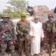 Terror bandits in a picture with the Managing Director of Bank of Agriculture, Hassan who was abducted during the attack on Kaduna-Abuja bound train