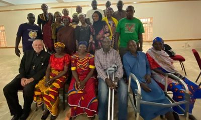 Mission team leaders, Dr William Devlin and international human rights lawyer, Emmanuel Ogebe, with some affected victims of the killings