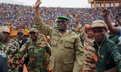 Leader of the Niger Republic junta General Abdourahmane Tchiani acknowledging cheers from admiring crowd