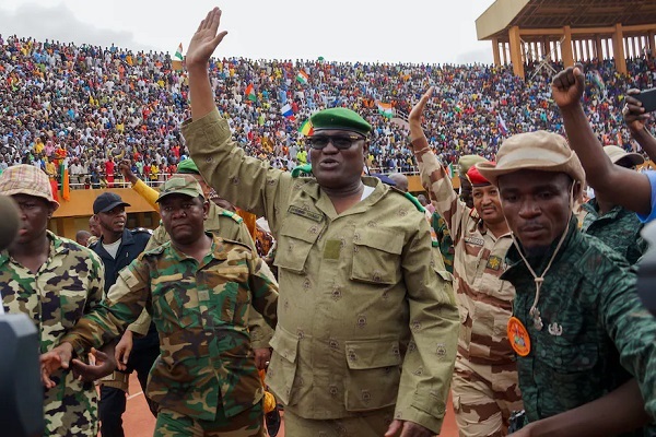 Leader of the Niger Republic junta General Abdourahmane Tchiani acknowledging cheers from admiring crowd
