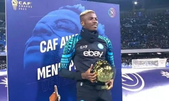 Victor Osimhen presenting CAF Footballer of the Year award to Napoli fans