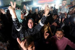 Palestinian women and children celebrating in Gaza after Israel and Hamas declared ceasefire