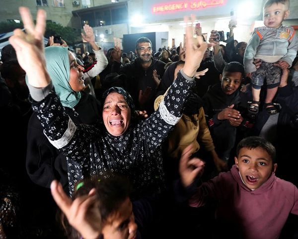 Palestinian women and children celebrating in Gaza after Israel and Hamas declared ceasefire