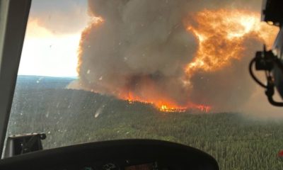 Military aircraft evacuates residents amid growing Canada wildfires