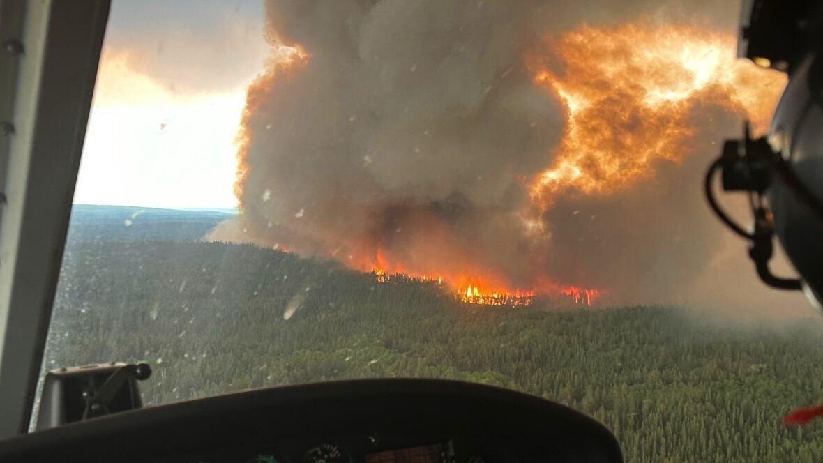 Military aircraft evacuates residents amid growing Canada wildfires