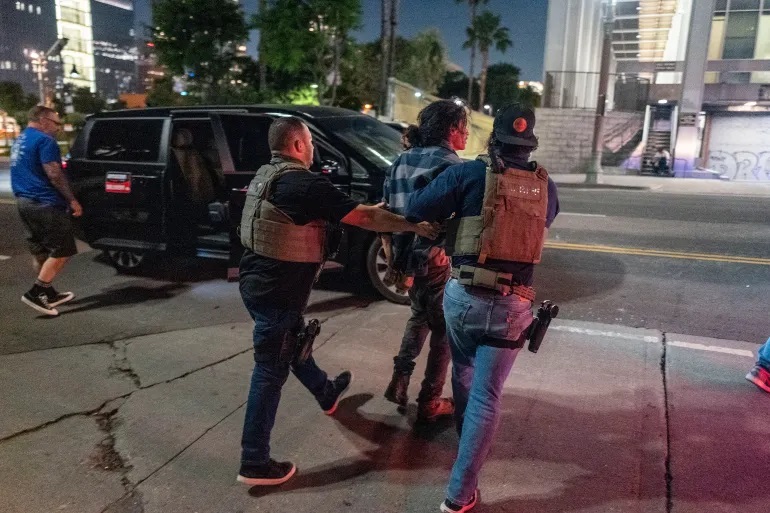 LA imposes curfew-makes arrests-amid protests