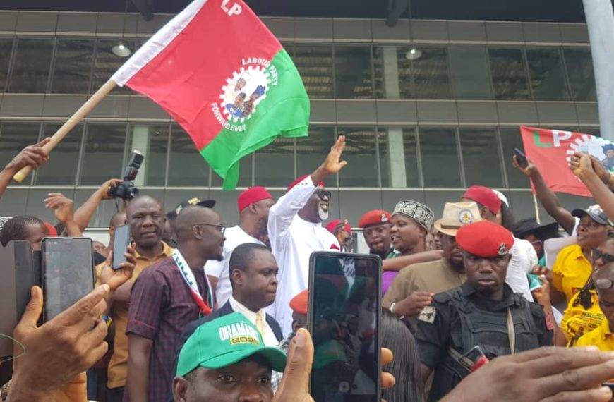 Chief Dr. George Moghalu arrives to a rousing reception as the 