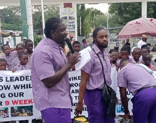 VeryDarkman and school children stage protest in Abuja