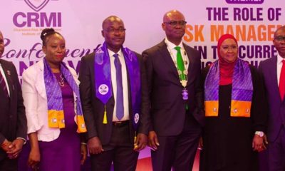 Kevin Ugwuoke flanked left and right by officials of Fidelity Bank and Chartered Risk Management Institute of Nigeria