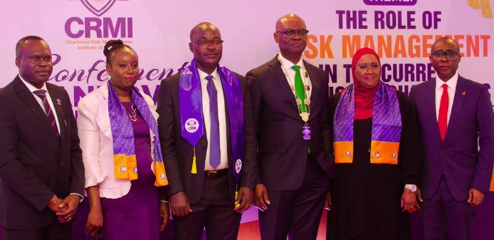 Kevin Ugwuoke flanked left and right by officials of Fidelity Bank and Chartered Risk Management Institute of Nigeria
