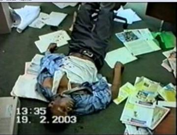 Michael Lekare Wayi's lifeless body in his scattered office