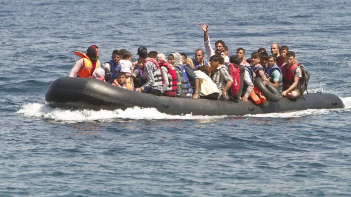 migrants inside boat.