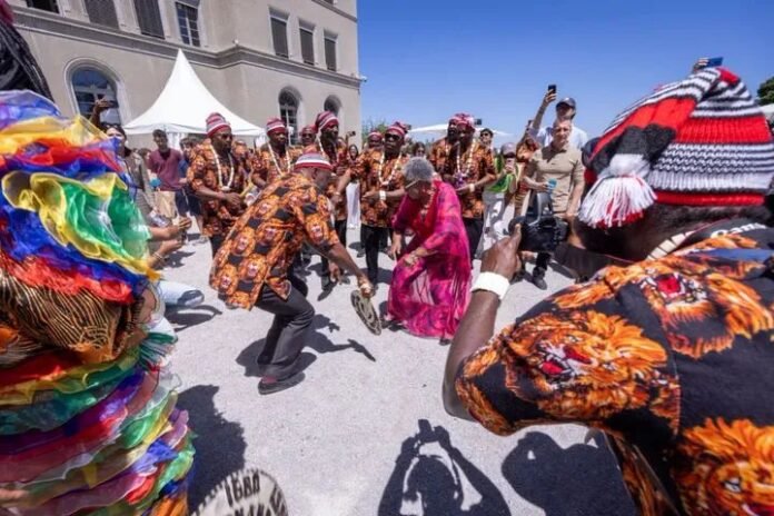 Dr. Ngozi Okonjo-Iweala dancing to the rhythm of Igbo song at WTO headquarters in Geneva