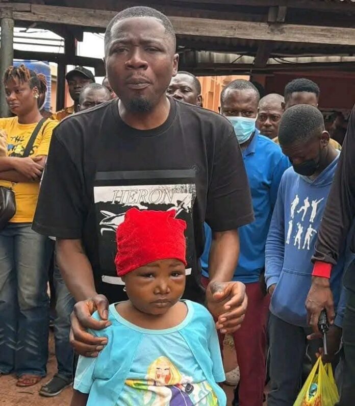 Okwulora and a sick child